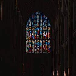 stained glass window depicting Jesus and disciples