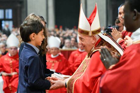 Pope Francis accepts the offertory gifts during Pentecost Mass in St. Peter's Basilica at the Vatican on May 19, 2023. (CNS photo/Lola Gomez)