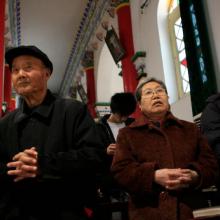 Chinese Catholics pray during Mass in 2007 at St. Francis Cathedral in Xi'an. (CNS photo/Nancy Wiechec)