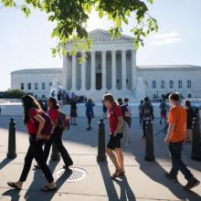 People gather outside the U.S. Supreme Court on June 26 in Washington. (CNS photo/Jim Lo Scalzo, EPA)