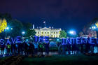 Demonstrators gather outside the White House in November 2014 to show their support for net neutrality. (Flickr/Joseph Gruber)