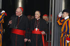 Swiss Guards salute as Cardinals Timothy M. Dolan of New York and Daniel N. DiNardo of Galveston-Houston leave a meeting of cardinals with Pope Francis in the synod hall at the Vatican Feb. 21, 2014. (CNS photo/Paul Haring) 