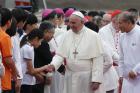 Pope Francis greets people as he arrives in Seoul, South Korea. (CNS photo/Paul Haring)