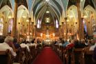 More than 2,000 people attend Mass at historic St. Albertus Church in Detroit Aug. 10. The Mass was organized as part of a "Mass mob" movement to fill now-closed historic inner-city Detroit churches for occasional Masses. St. Albertus is no longer an active parish but the church remains open as a center for Polish heritage. (CNS photo/Jonathan Francis, Archdiocese of Detroit)