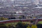 A section of the Peace Wall that divides Catholic and Protestant communities cuts its way through West Belfast, Northern Ireland. (CNS photo/Cathal McNaughton, Reuters)