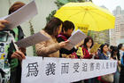 Hong Kong residents hold a banner that reads: “Blessed are those who are persecuted for righteousness’ sake.” The Occupy Central movement was initiated as an effort to force the Hong Kong and Chinese governments to allow true democracy in the city. (CNS photo/Francis Wong)