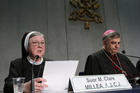 Sister Mary Clare Millea, then superior general of the Apostles of the Sacred Heart of Jesus, speaks on Dec. 16, 2014 at a Vatican press conference for release of the final report of a Vatican-ordered investigation of U.S. communities of women religious. Sister Millea was the Vatican-appointed director of the visitation. At right is Archbishop Jose Rodriguez Carballo, secretary of the Vatican's Congregation for Institutes of Consecrated Life and Societies of Apostolic Life. (CNS photo/Paul Haring) 
