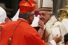 Pope Francis greets new Cardinal Soane Mafi of Tonga during the February 2015 consistory at St. Peter's Basilica at the Vatican. (CNS photo/Paul Haring)