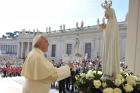 Pope Francis prays in front of a statue of Our Lady of Fatima during his general audience in St. Peter's Square at the Vatican May 13. The statue, which was present for the May 13 feast of Our Lady of Fatima, is a copy of the original in Fatima, Portugal. (CNS photo/L'Osservatore Romano, pool) 