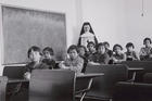 A 1940 photo shows indigenous students and a nun in a girls' classroom at Cross Lake Indian Residential School in Manitoba. (CNS photo/Library and Archives Canada, Reuters) 