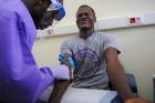 The blood of a survivor of the Ebola virus is extracted as part of a study launched at Liberia's John F. Kennedy Hospital in Monrovia in June 2015. (CNS photo/Reuters)