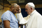 Pope Francis blesses a prisoner as he visits the Curran-Fromhold Correctional Facility in Philadelphia in September 2015. (CNS photo/Paul Haring)