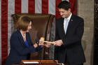 Former U.S. House Speaker and current Minority Leader Nancy Pelosi, D-Calif., hands incoming House Speaker Paul Ryan, R-Wis., the gavel after his election on Capitol Hill in Washington Oct. 29, 2015. (CNS photo/Gary Cameron, Reuters) 