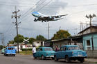 Air Force One carrying U.S. President Barack Obama and his family flies over a Havana neighborhood in Cuba as it approaches the runway March 20. (CNS photo/Alberto Reyes, Reuters)