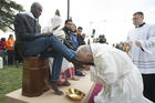 Pope Francis kisses the foot of a refugee during Holy Thursday Mass of the Lord's Supper at the Center for Asylum Seekers in Castelnuovo di Porto, about 15 miles north of Rome in March 2016. The pope washed and kissed the feet of refugees, including Muslims, Hindus and Copts. (CNS photo/L'Osservatore Romano, handout)