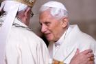 Pope Francis greets retired Pope Benedict XVI prior to the opening of the Holy Door of St. Peter's Basilica at the Vatican in 2015. (CNS photo/Maurizio Brambatti, EPA)