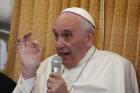 Pope Francis answers questions from journalists aboard his flight from Baku, Azerbaijan, to Rome Oct. 2. (CNS photo/Paul Haring)