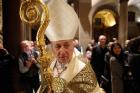 New Cardinal Blase J. Cupich of Chicago leaves a prayer service at which he took possession of his titular church of St. Bartholomew on Tiber Island in Rome on Nov. 20. (CNS photo/Paul Haring) 