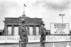 Border policemen stand next to the sign at the Berlin Wall and Brandenburg Gate in Berlin June 17, 1986. The sign says: "Achtung! Sie verlassen jetzt West-Berlin" (Attention, you are leaving West Berlin). (CNS photo/Wolfgang Kumm, EPA)