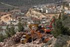 Heavy equipment is seen as workers clear an area for the construction of a new home on Feb. 7 in the Israeli settlement of Shilo, West Bank. (CNS photo/Jim Hollander, EPA)