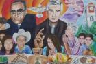 A mural in El Paisnal, El Salvador, seen in this Jan. 29 photo, features Blessed Oscar Romero and town native Father Rutilio Grande, surrounded by rural men, women and children, the community the Jesuit Father Grande served from 1972 until his March 12, 1977, assassination. (CNS photo/Rhina Guidos)