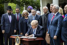 President Donald Trump signs his Executive Order on Promoting Free Speech and Religious Liberty during a National Day of Prayer event at the White House in Washington on May 4. (CNS photo/Jim Lo Scalzo, EPA)