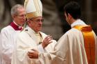 Pope Francis ordains one of 10 new priests for the Diocese of Rome during an ordination Mass in St. Peter's Basilica at the Vatican on May 7. (CNS photo/Paul Haring)