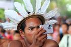 An indigenous member of the Desano ethnic group handles a camera during a meeting in Mitu, Colombia, on Aug. 19, 2016.  (CNS photo/Mauricio Duenas Castaneda, EPA)