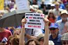 A woman holds up a sign during a rally against assisted suicide in 2016 on Parliament Hill in Ottawa, Ontario. (CNS photo/Art Babych)