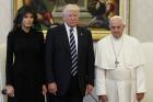 Pope Francis poses with U.S. President Donald Trump and his wife, Melania, during a private audience at the Vatican May 24. (CNS photo/Paul Haring) See POPE-TRUMP-MEET May 24, 2017.