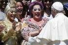 Pope Francis greets artists from Cirque du Soleil during his general audience in St. Peter's Square at the Vatican May 31. (CNS photo/Paul Haring)