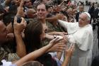 Pope Francis greets the crowd as he leaves his general audience in St. Peter's Square at the Vatican on June 28. (CNS photo/Paul Haring)