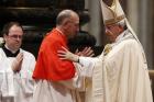 Pope Francis embraces Cardinal Juan Jose Omella of Barcelona, Spain, as the pontiff leads a consistory in St. Peter's Basilica at the Vatican June 28. The Spaniard was one of five men elevated to cardinal at the service. (CNS photo/Paul Haring) 