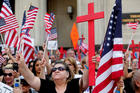 Demonstrators rally outside the federal court in Detroit on June 21, 2017, before a hearing to consider a class-action lawsuit filed on behalf of Iraqi nationals facing deportation. (CNS photo/Rebecca Cook, Reuters) 