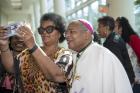 Retired Bishop Gordon D. Bennett of Mandeville, Jamaica, poses for a photo with an attendees of the 12th National Black Catholic Congress on July 9 in Orlando. (CNS/courtesy Nancy Jo Davis, National Black Catholic Congress)