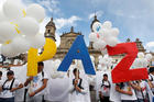 People outside the cathedral in Bogota chant "No more war" on Sept. 26, 2016, after the Colombian government and Marxist rebels signed an agreement to end their conflict. (CNS photo/Felipe Caicedo, Reuters)