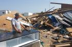 Lin Barton surveys the damage at the marina in Rockport where he has lived and worked. (Photos by Jan-Albert Hootsen)