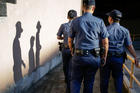 Philippine police are seen in Pasay City on Sept. 6. Manila Cardinal Luis Antonio Tagle ordered church bells to ring in that archdiocese every evening starting Sept. 14 to remember the thousands of people killed in the government's campaign against drug dealers and addicts. (CNS photo/Mark R. Cristino, EPA)