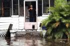 A man signals to police officers from a flooded house after Hurricane Irma passed through Daytona Beach, Fla. (CNS photo/Daytona Beach Police Department handout via Reuters)