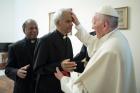 Salesian Father Tom Uzhunnalil, who was released on Sept. 12 after having been kidnapped 18 months ago in Yemen, is anointed by Pope Francis during a Sept. 13 meeting at the Vatican. (CNS photo/L'Osservatore Romano)