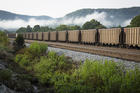 A train carries coal near Ravenna, Ky., in this 2014 file photo. Catholic groups are developing a new tool to rank countries' work in human and environmental development. (CNS photo/Tyler Orsburn)