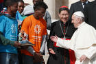 Pope Francis greets Cardinal Luis Antonio Tagle of Manila, Philippines, and representatives of the “Share the Journey” campaign by Caritas Internationalis in support of immigrants, at the Vatican on Sept. 27. (CNS photo/Paul Haring)