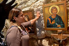 A woman prays on the Via Dolorosa in the Old City of Jerusalem on Sept. 11. The city is considered sacred to Christians, Jews and Muslims. (CNS photo/Debbie Hill)