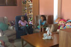 Gloria Gallardo and her granddaughter, Diana Diaz, 14, are seen in a still photo taken from video at the Nuestra Senora de la Esperanza house in Caracas, Venezuela. Diaz was born with both HIV and hepatitis B and has lived with diabetes since she was 9.(CNS photo/Cody Weddle)