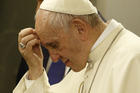 Pope Francis pauses as he answers questions from journalists aboard his flight from Dhaka, Bangladesh, to Rome Dec. 2. (CNS photo/Paul Haring)