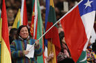 A woman holds Chile's flag as Pope Francis celebrates Mass marking the World Day of Migrants and Refugees in St. Peter's Basilica at the Vatican Jan. 14. The pope is scheduled to arrive in Santiago, Chile, Jan. 15. (CNS photo/Paul Haring)