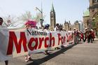 Pro-life supporters carry a banner during the annual National March for Life in 2016 on Parliament Hill in Ottawa, Ontario. Pro-life advocates are making plans to address a new law in Ontario that will create "bubble zones" around abortion facilities in in Ottawa and likely force the march to find a new route. (CNS photo/Art Babych)