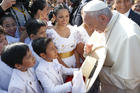 A boy presents a hat to Pope Francis upon his arrival at the international airport in Trujillo, Peru, Jan. 20. (CNS photo/Paul Haring) 