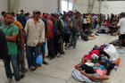 Central American migrants gather before continuing their journey on March 31 in Ixtepec, Oaxaca, Mexico. (CNS photo/Jose Jesus Cortes, Reuters) 