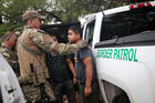 Members of the U.S. Border Patrol apprehend an immigrant from Guatemala on June 19 near Falfurrias, Texas. (CNS photo/Adrees Latif, Reuters)